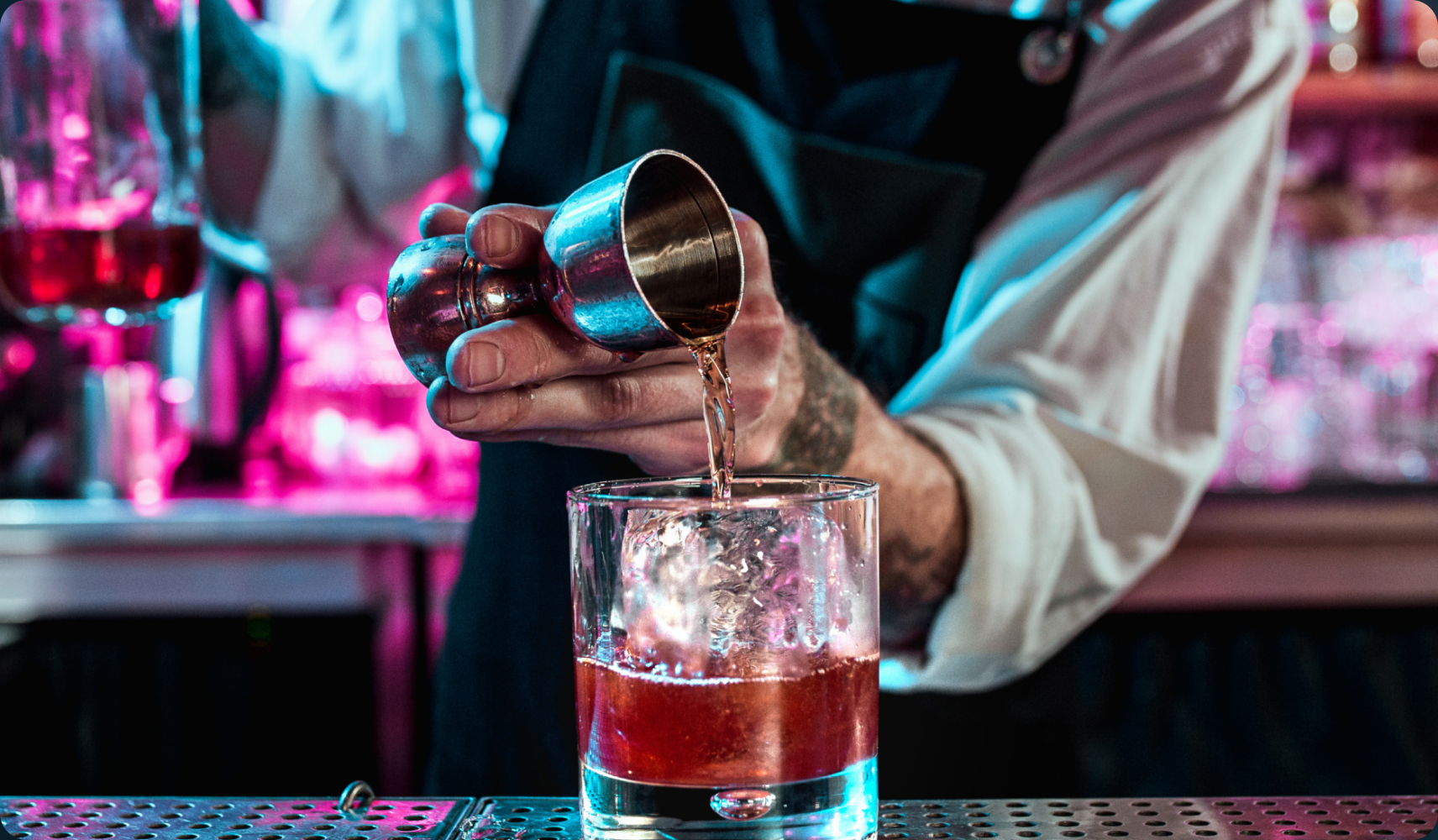 Bartender pouring a cocktail