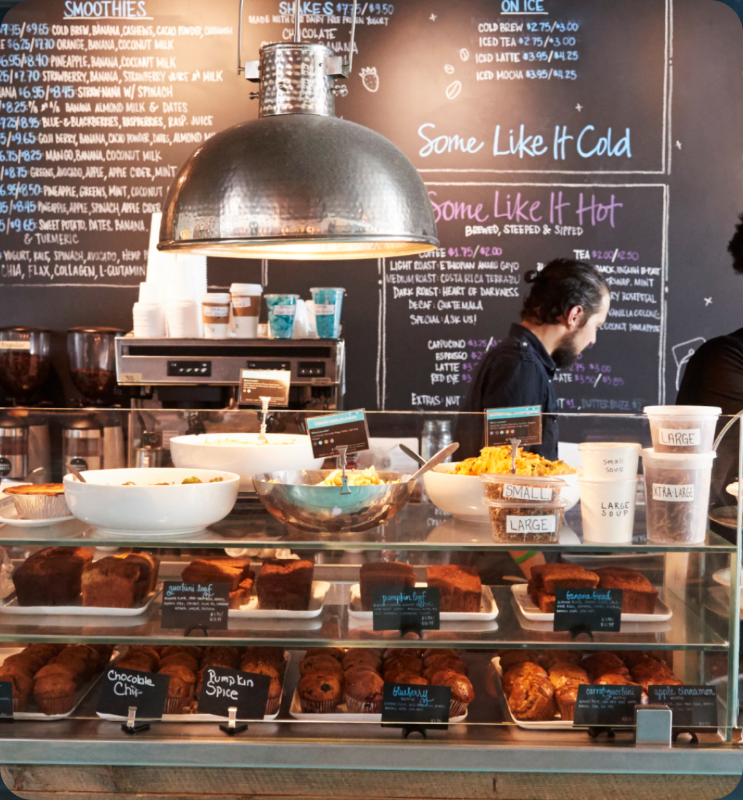 Cafe bakery display and chalkboard menu